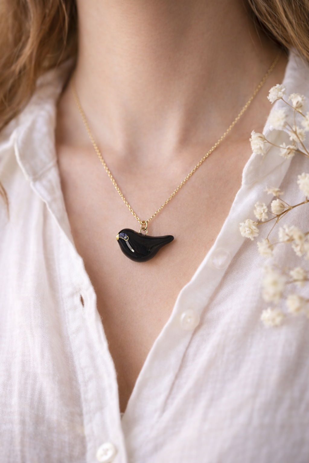 Collier merle en or et pendentif oiseau